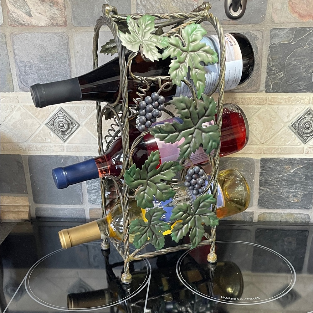 New Decorative Wine Rack with Grape Leaf Design holds three bottles of wine